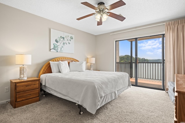 5371 Central Ave Unit 6E, Hot Springs, AR 71913 - bedroom featuring access to outside, carpet floors, a textured ceiling, a water view, and a ceiling fan
