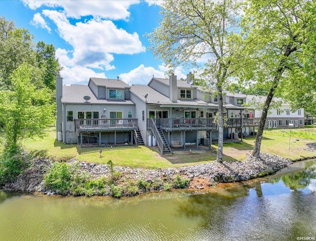 173C Pebble Beach Pl, Hot Springs, AR 71913 - back of property with stairs, a deck with water view, a chimney, and a lawn