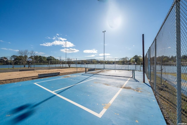 view of sport court with fence