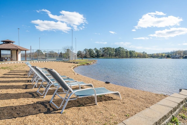 view of water feature with a gazebo and fence