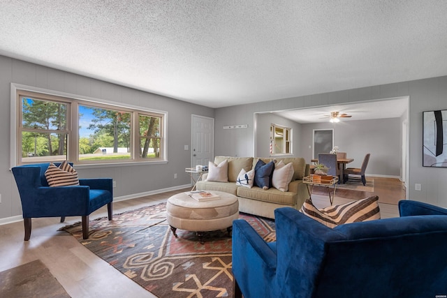 235 Echo Pt, Hot Springs, AR 71913 - living room with wood finished floors, ceiling fan, and a textured ceiling