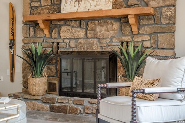 room details featuring a stone fireplace and visible vents