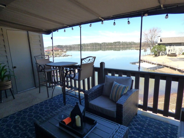 wooden deck featuring a water view