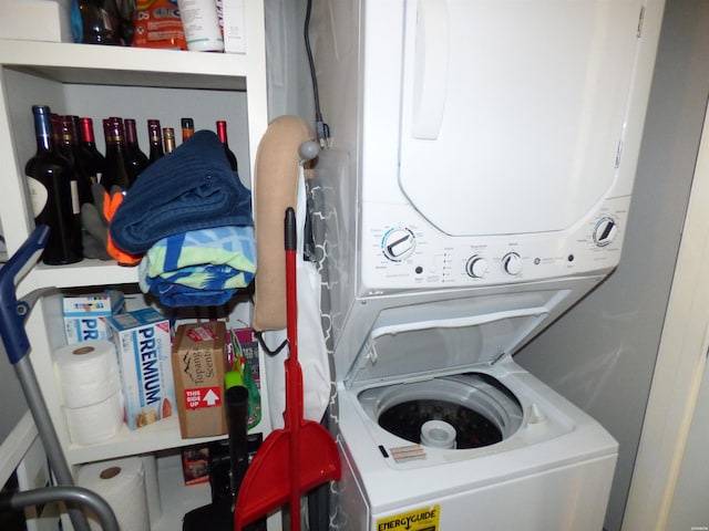 washroom featuring laundry area and stacked washer / drying machine