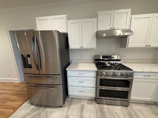 kitchen featuring stainless steel appliances, white cabinets, ornamental molding, and under cabinet range hood