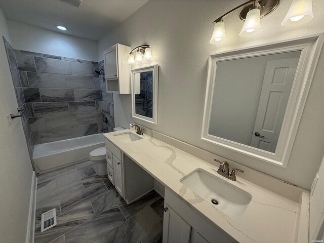 full bathroom featuring toilet, shower / tub combination, visible vents, and a sink