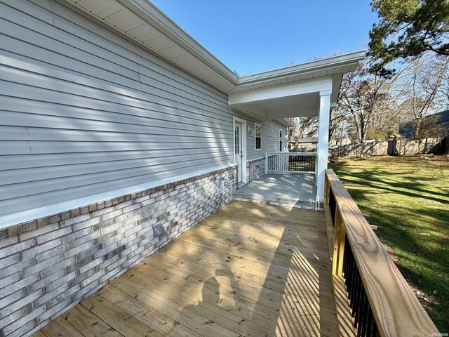 deck featuring a lawn