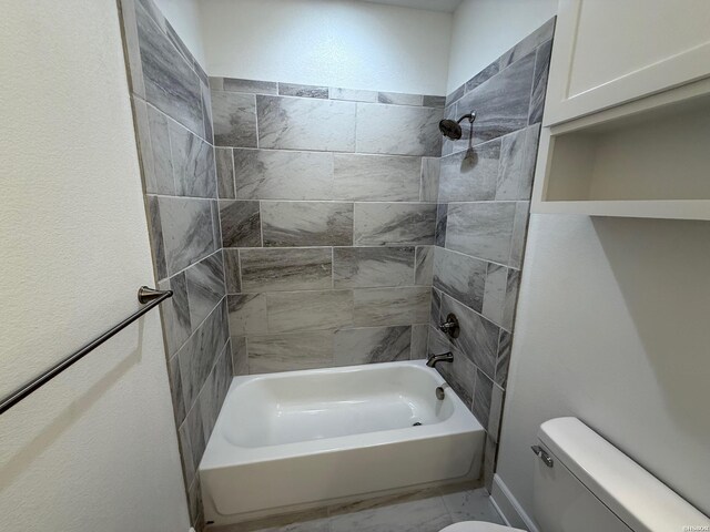 full bath with toilet, marble finish floor, and shower / washtub combination