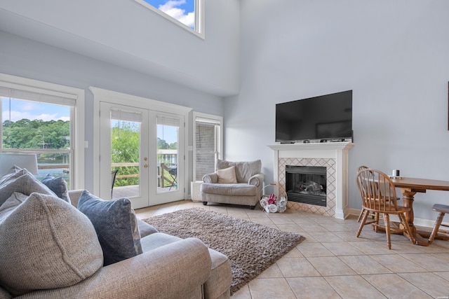 181 Fish Hatchery Rd Unit P2, Hot Springs, AR 71913 - living area with light tile patterned floors, a high ceiling, french doors, and a fireplace