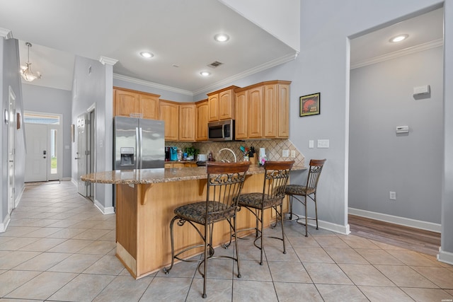 181 Fish Hatchery Rd Unit P2, Hot Springs, AR 71913 - kitchen with appliances with stainless steel finishes, light tile patterned floors, a peninsula, stone countertops, and ornamental molding