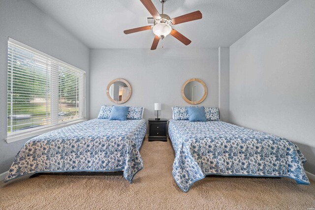 bedroom with carpet floors and a ceiling fan