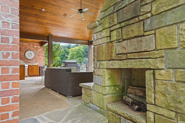 view of patio with a ceiling fan, a grill, and an outdoor fireplace