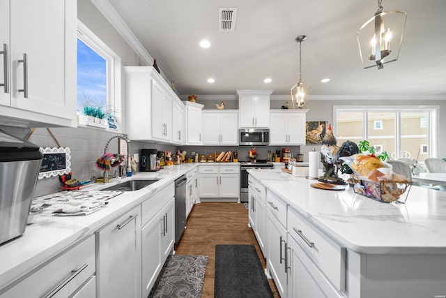 150 Villa Pointe Pt Unit A, Hot Springs, AR 71913 - kitchen featuring appliances with stainless steel finishes, a sink, crown molding, white cabinetry, and recessed lighting