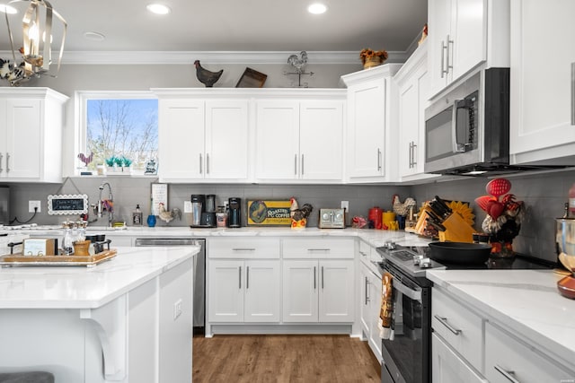 150 Villa Pointe Pt Unit A, Hot Springs, AR 71913 - kitchen featuring stainless steel appliances, crown molding, white cabinets, a sink, and backsplash