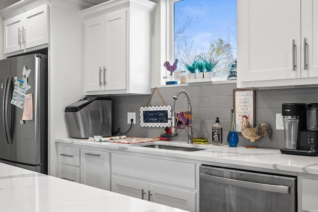150 Villa Pointe Pt Unit A, Hot Springs, AR 71913 - kitchen featuring appliances with stainless steel finishes, white cabinetry, backsplash, light stone counters, and a sink