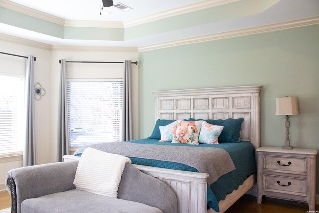 bedroom featuring visible vents and crown molding