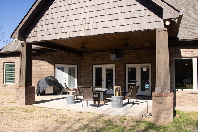 view of patio / terrace featuring a ceiling fan and french doors