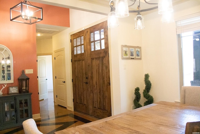 foyer entrance featuring an inviting chandelier