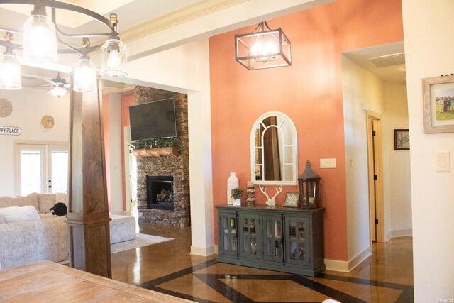 interior space with a towering ceiling and baseboards