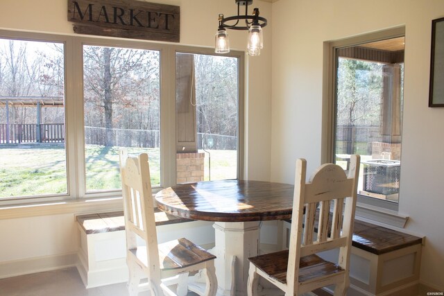 dining space with a chandelier and plenty of natural light