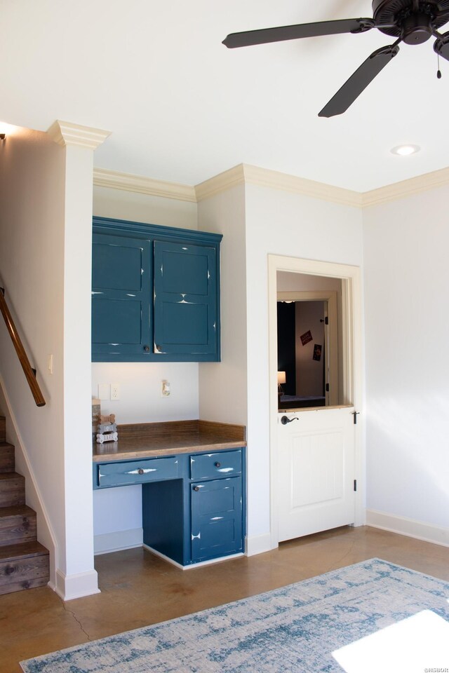 interior space with ornamental molding, ceiling fan, baseboards, and stairs