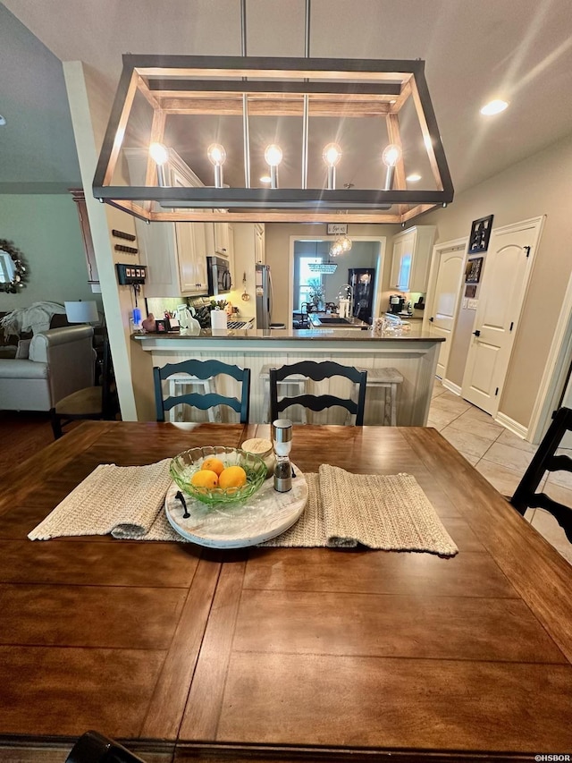 dining area featuring recessed lighting and light tile patterned flooring