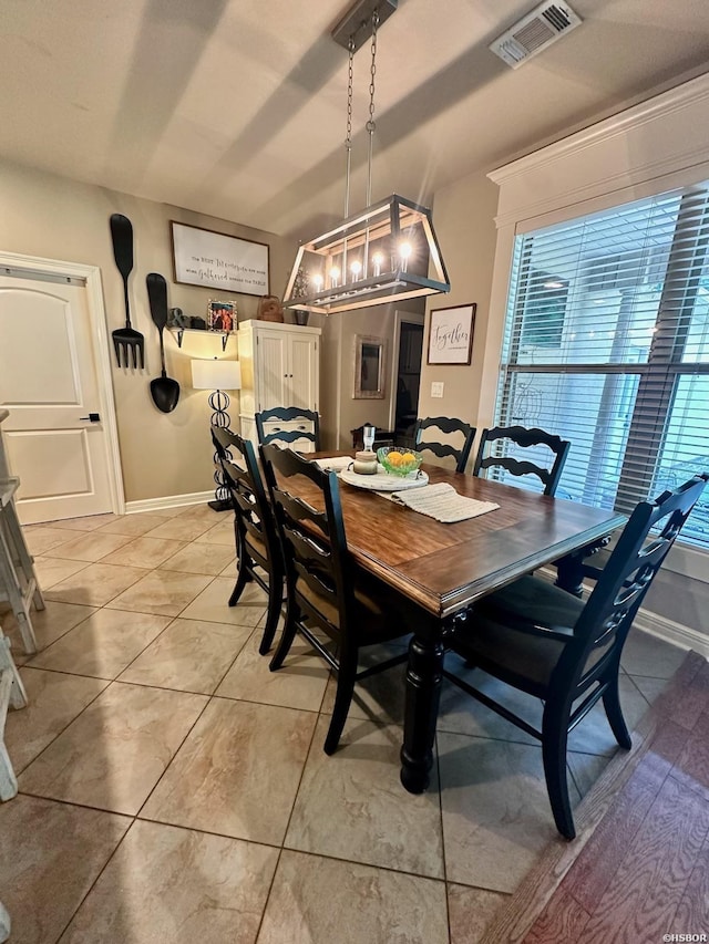 dining room featuring visible vents, baseboards, and light tile patterned floors