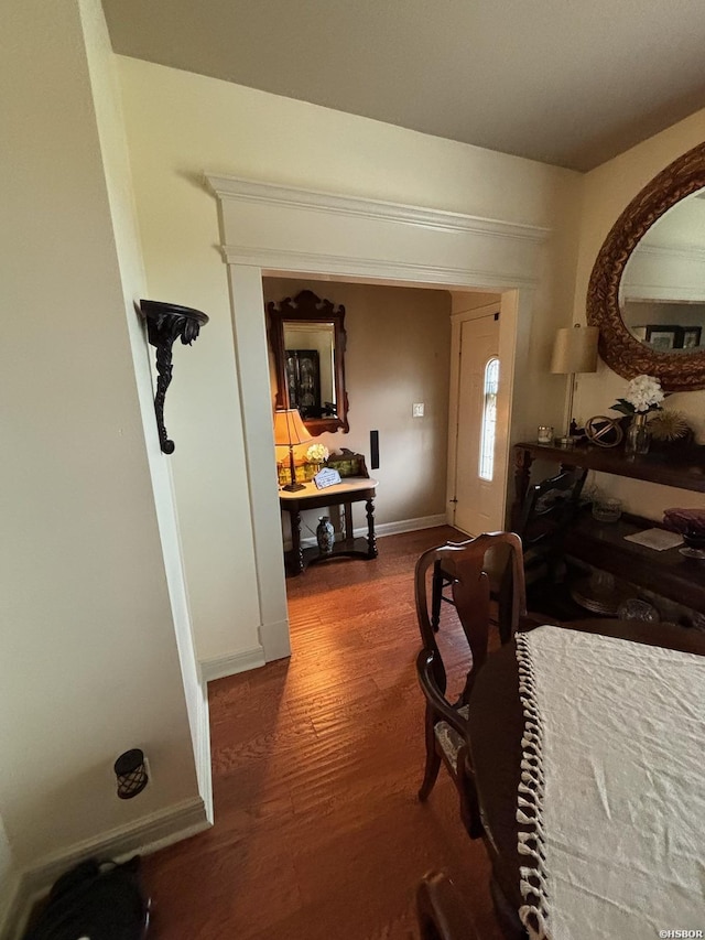 bedroom featuring baseboards and wood finished floors