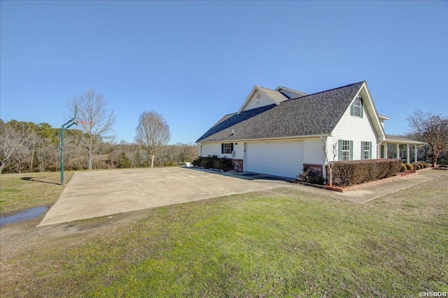 view of property exterior featuring driveway, an attached garage, a shingled roof, and a yard