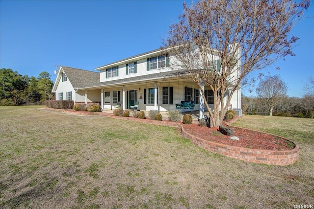 view of front facade featuring covered porch and a front lawn