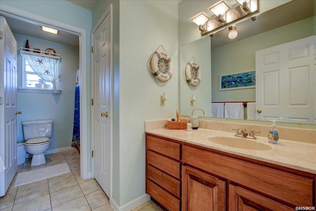 full bathroom with toilet, tile patterned flooring, baseboards, and vanity