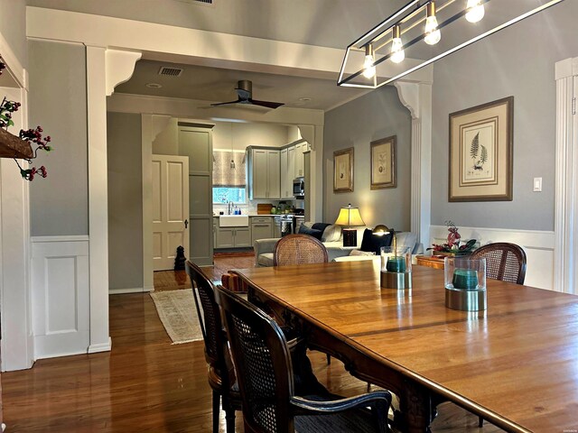 dining room with ceiling fan, dark wood finished floors, and visible vents