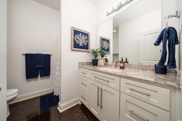1129 Marion Anderson Rd, Hot Springs, AR 71913 - full bathroom with vanity, baseboards, and toilet
