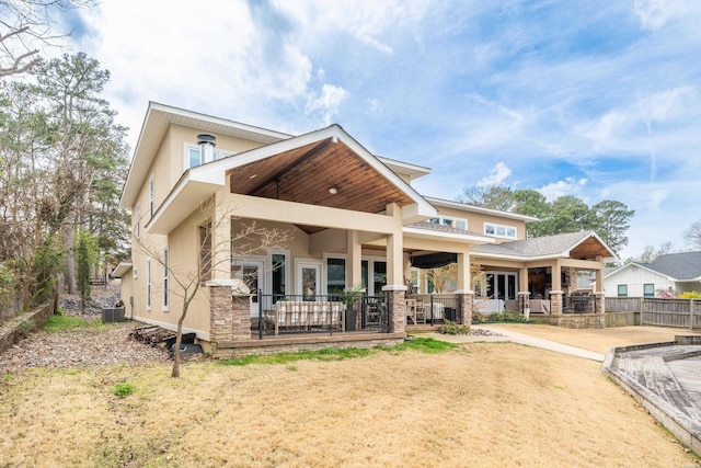 1129 Marion Anderson Rd, Hot Springs, AR 71913 - rear view of property with stucco siding, central AC, and a patio