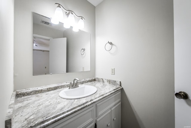 bathroom featuring visible vents and vanity