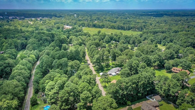 birds eye view of property with a forest view