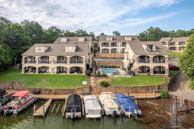 409 Halteria Ln Unit B, Hot Springs, AR 71913 - back of property with a balcony, a lawn, uncovered parking, and a patio area