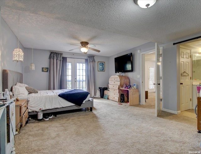 carpeted bedroom with multiple windows, french doors, ceiling fan, and a textured ceiling