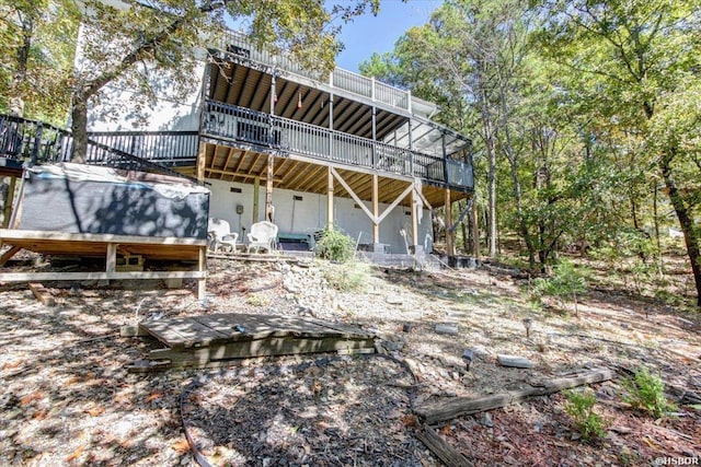 rear view of house featuring a deck