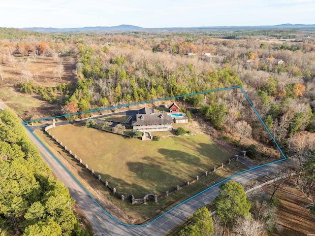 drone / aerial view with a view of trees