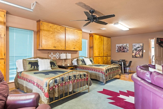 bedroom featuring a textured ceiling and ceiling fan