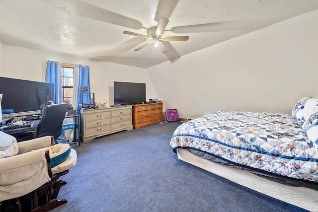 bedroom featuring ceiling fan, dark carpet, vaulted ceiling, and a textured ceiling