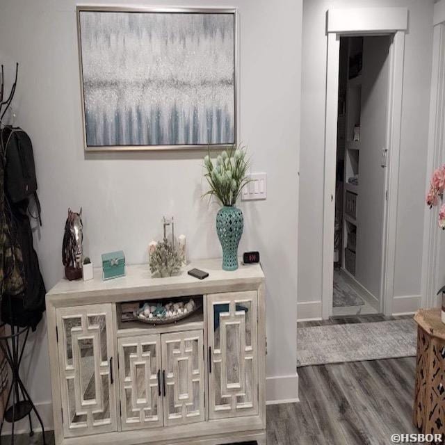 interior space with dark wood-style floors and baseboards