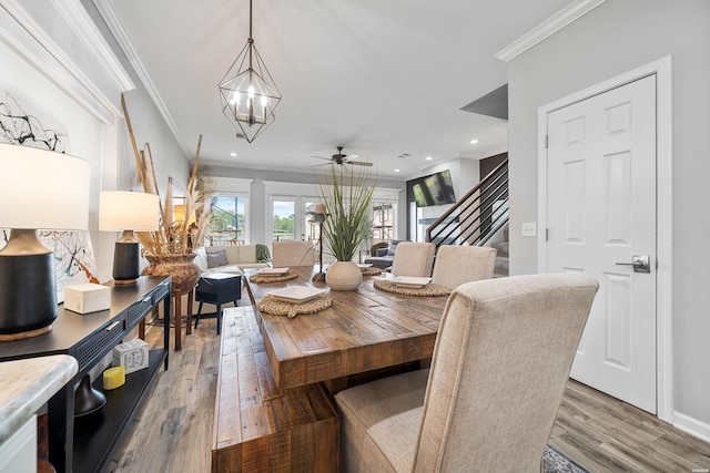 125 Eagle View Pt, Hot Springs, AR 71913 - dining area featuring a chandelier, ornamental molding, stairway, light wood-style floors, and a ceiling fan