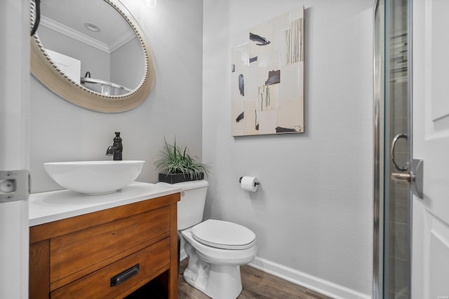 125 Eagle View Pt, Hot Springs, AR 71913 - bathroom featuring crown molding, baseboards, vanity, wood finished floors, and toilet