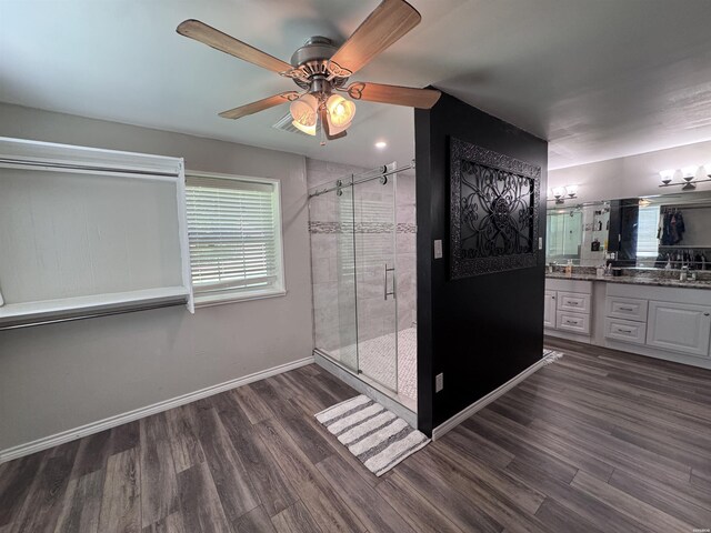 612 Independence, Hot Springs, AR 71913 - full bathroom featuring vanity, a ceiling fan, wood finished floors, and a shower stall