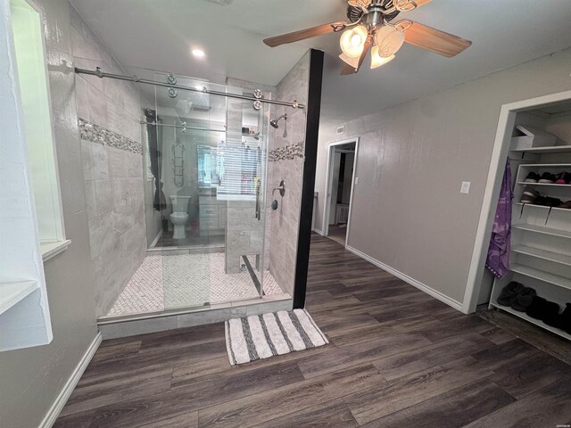 612 Independence, Hot Springs, AR 71913 - full bath featuring a ceiling fan, wood finished floors, and a stall shower