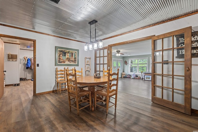 dining area featuring wood finished floors, a ceiling fan, baseboards, and french doors