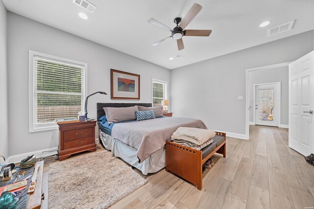 bedroom featuring light wood-type flooring, baseboards, visible vents, and recessed lighting