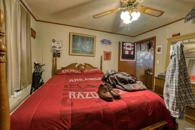 bedroom featuring a textured ceiling, a ceiling fan, and crown molding